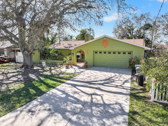 ranch-style home featuring a garage