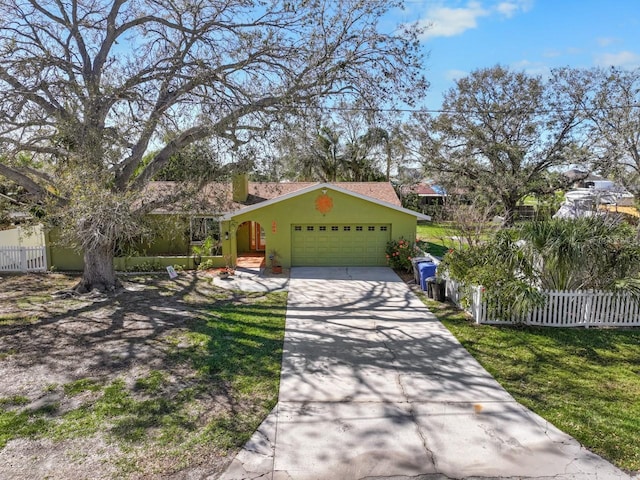 view of front facade featuring a front lawn and a garage