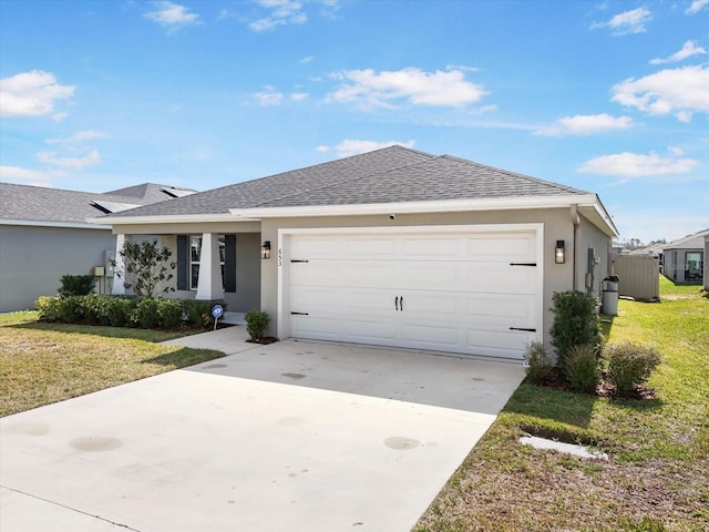 ranch-style home featuring a garage and a front lawn