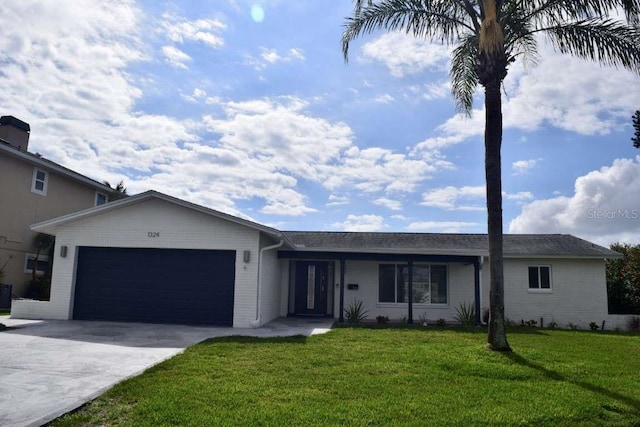 single story home featuring a garage and a front yard