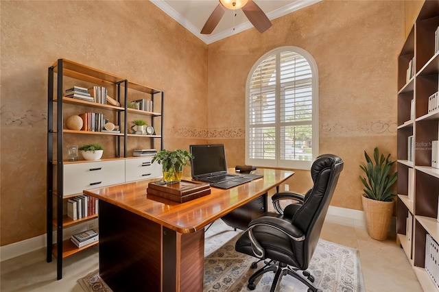 office area featuring light tile patterned floors, a towering ceiling, ornamental molding, and ceiling fan