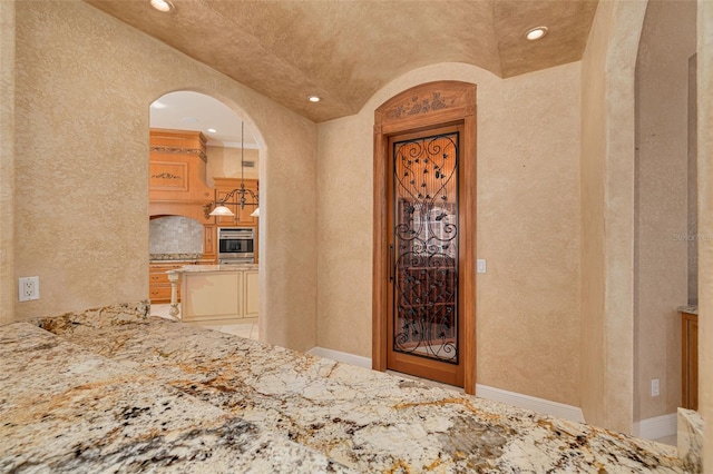 doorway to property featuring exterior kitchen