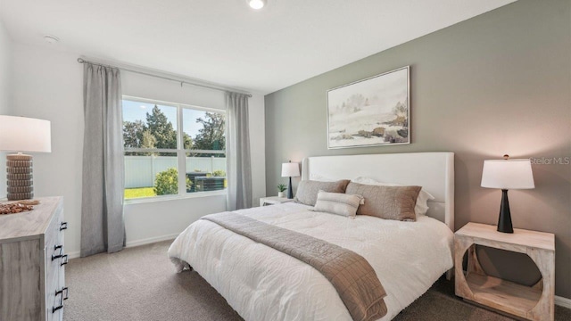 bedroom featuring light carpet