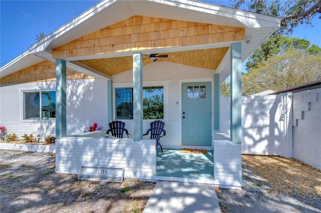 entrance to property with ceiling fan