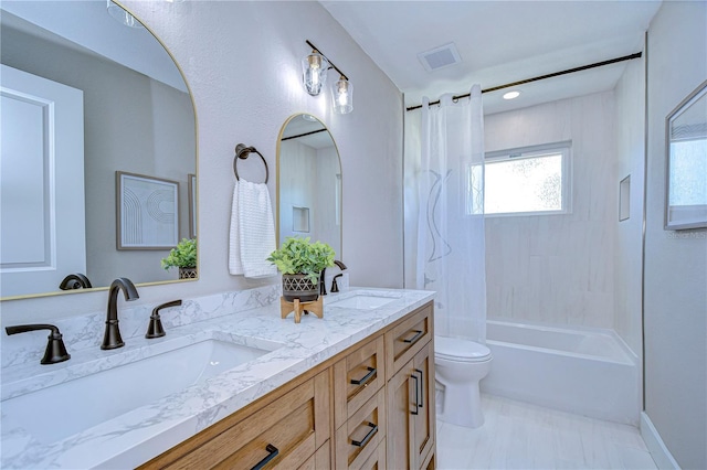 full bathroom with vanity, shower / tub combo with curtain, and toilet