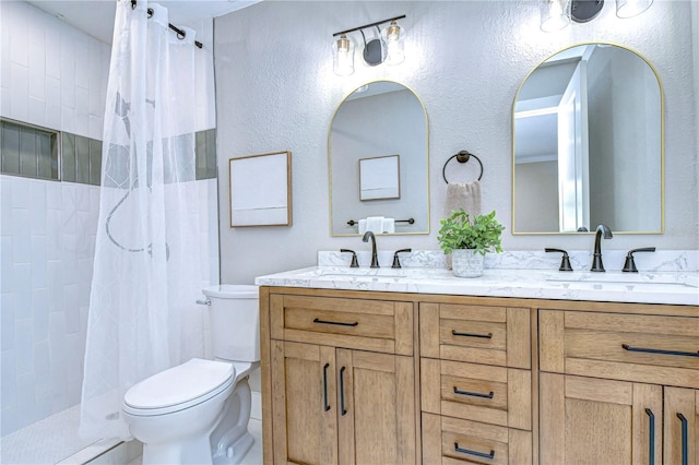 bathroom with walk in shower, vanity, and toilet