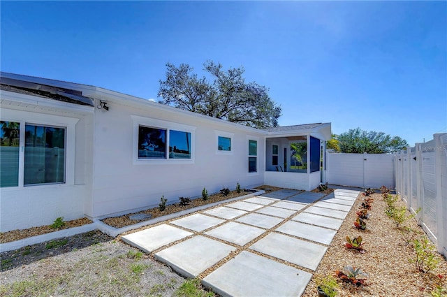 back of property with a patio