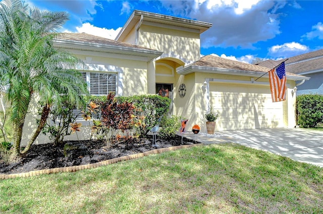 view of front facade featuring a garage and a front yard