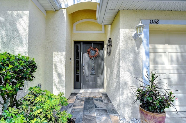 doorway to property featuring a garage