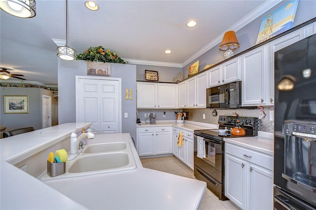 kitchen with sink, crown molding, black appliances, light tile patterned floors, and white cabinets