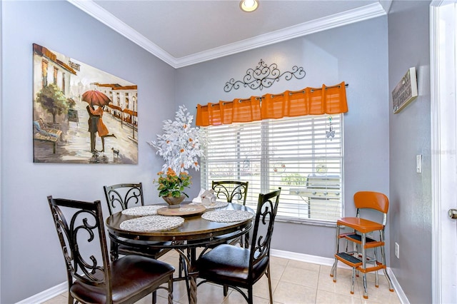 dining room featuring crown molding and light tile patterned flooring