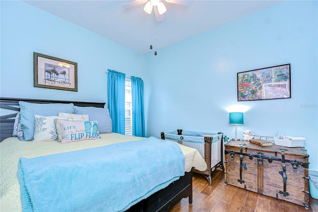 bedroom with hardwood / wood-style flooring and ceiling fan