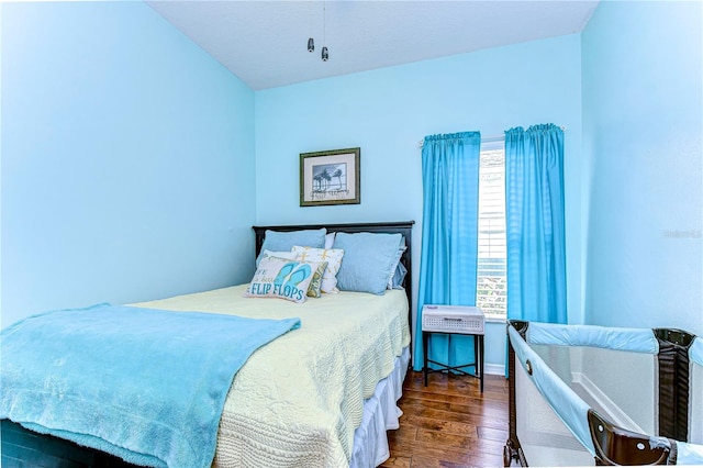 bedroom featuring dark wood-type flooring