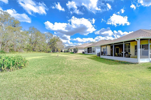 view of yard with a sunroom