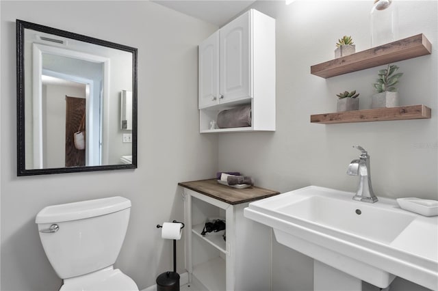 bathroom featuring a sink and toilet