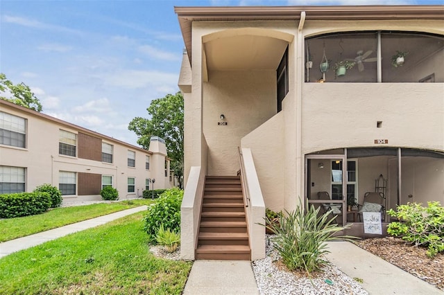 property entrance featuring stucco siding