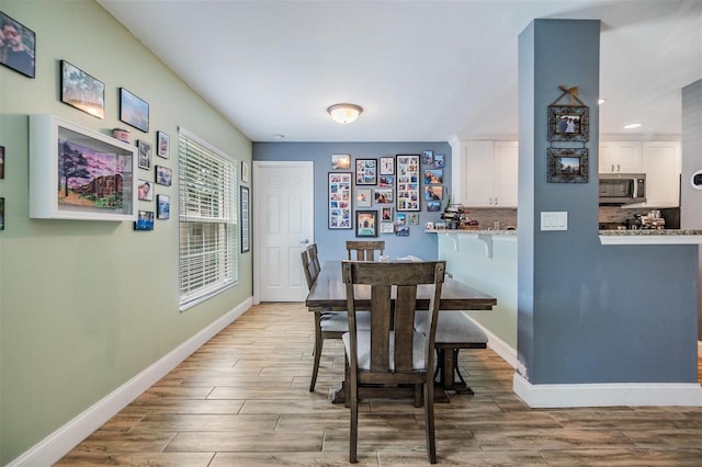 dining room with hardwood / wood-style floors