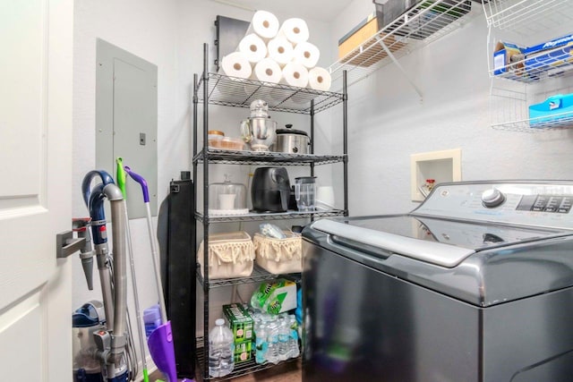 clothes washing area featuring laundry area and washer / clothes dryer