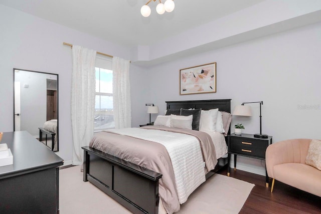 bedroom with wood finished floors