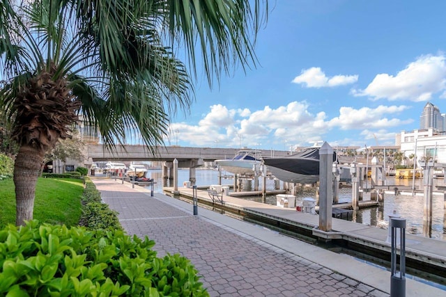 dock area with a water view and boat lift