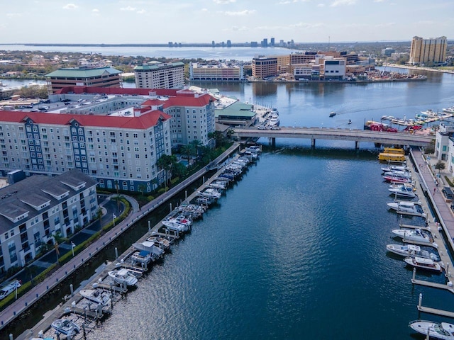 birds eye view of property with a water view and a city view