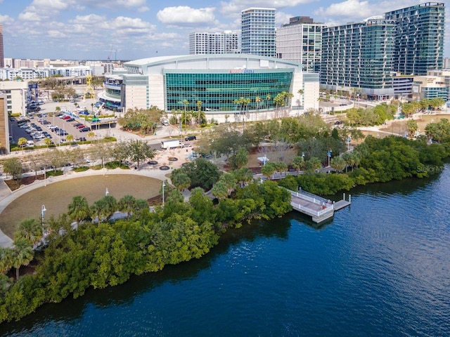 birds eye view of property featuring a view of city and a water view