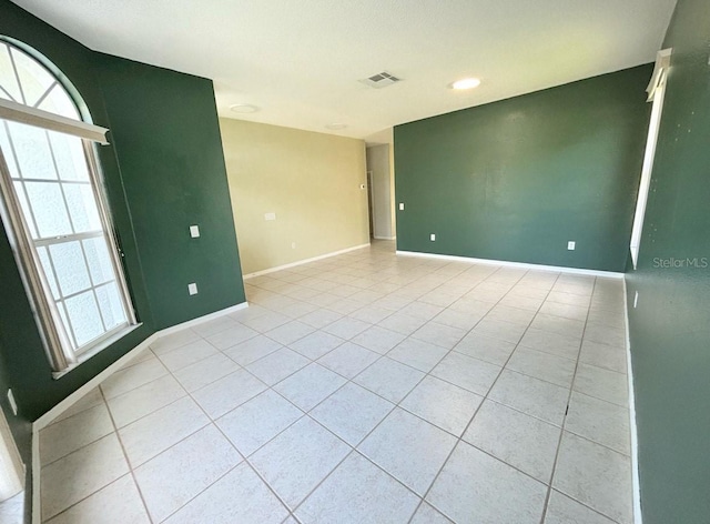 1609 Shady Oaks Dr, Oldsmar, FL 34677 - unfurnished room featuring light tile patterned floors, healthy amount of natural light, baseboards, and recessed lighting