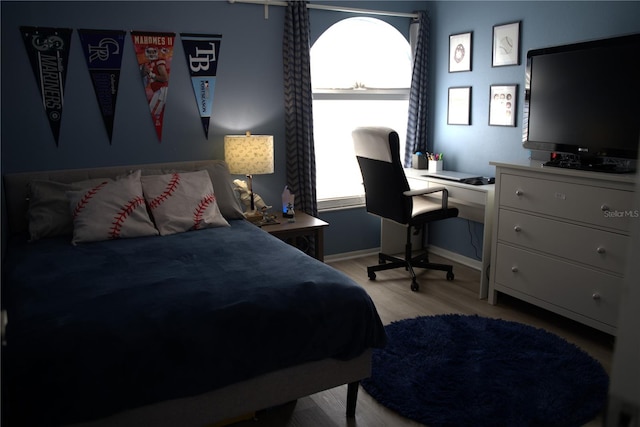 bedroom with light hardwood / wood-style floors