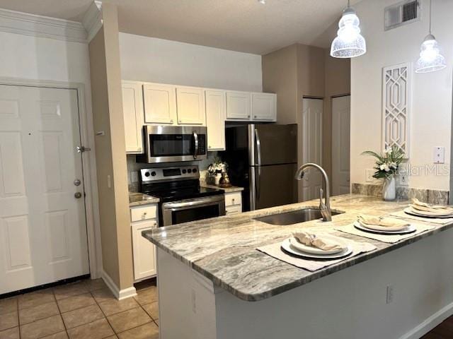 kitchen with white cabinetry, appliances with stainless steel finishes, and kitchen peninsula