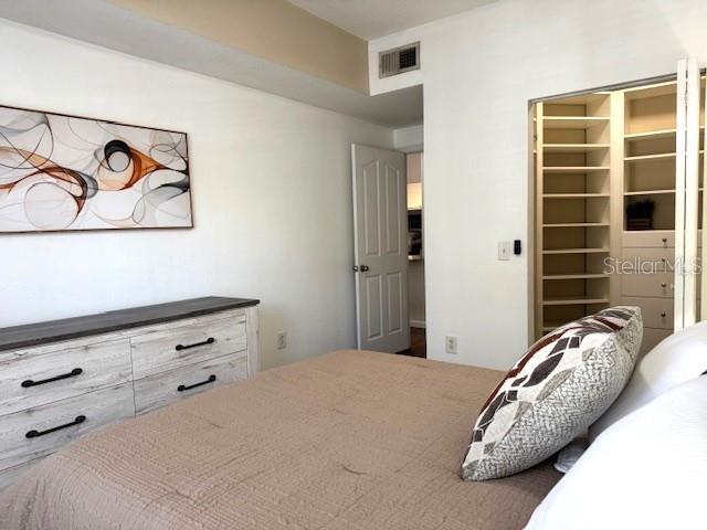 bedroom featuring a walk in closet