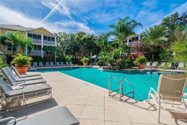 view of swimming pool featuring a patio area