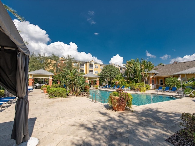 view of pool featuring a gazebo and a patio area