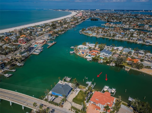 bird's eye view with a water view and a view of the beach