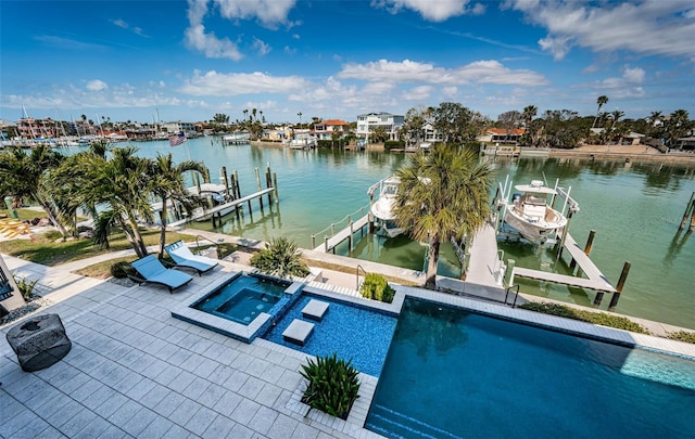 exterior space featuring a patio, boat lift, a water view, an in ground hot tub, and a dock