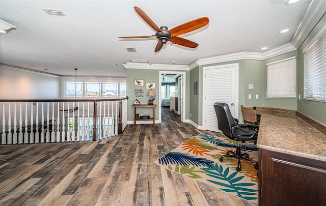 office space featuring dark wood-style floors, visible vents, and crown molding