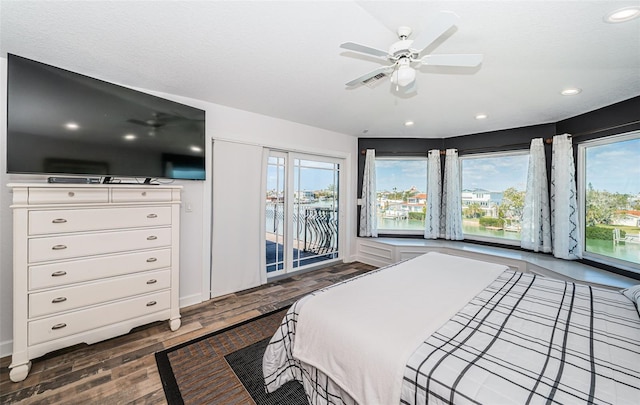 bedroom featuring ceiling fan, recessed lighting, dark wood finished floors, and access to exterior