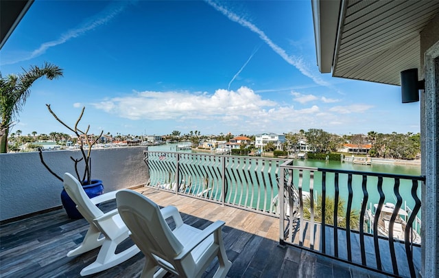 wooden terrace with a water view