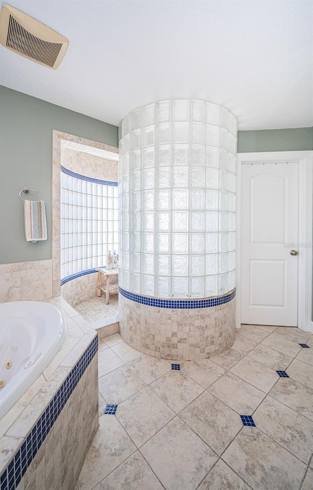 bathroom featuring visible vents and a whirlpool tub