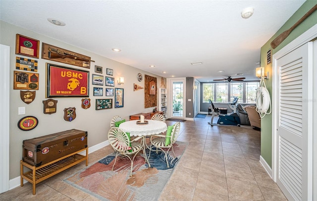 dining area featuring recessed lighting, baseboards, and light tile patterned floors