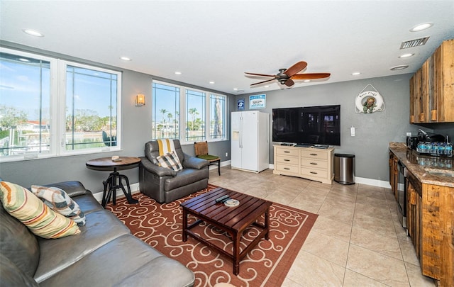 living area featuring recessed lighting, visible vents, baseboards, and light tile patterned flooring