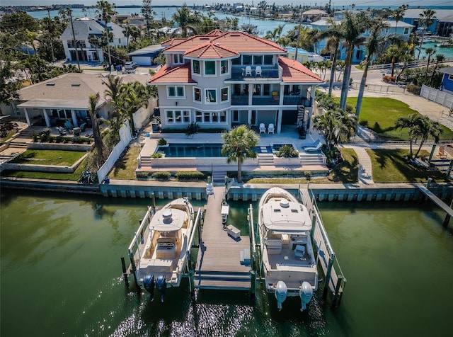 birds eye view of property with a residential view and a water view