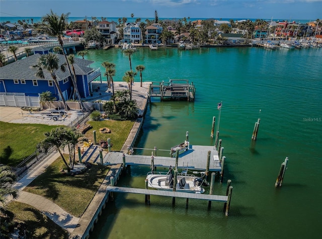 view of dock featuring a residential view and a water view