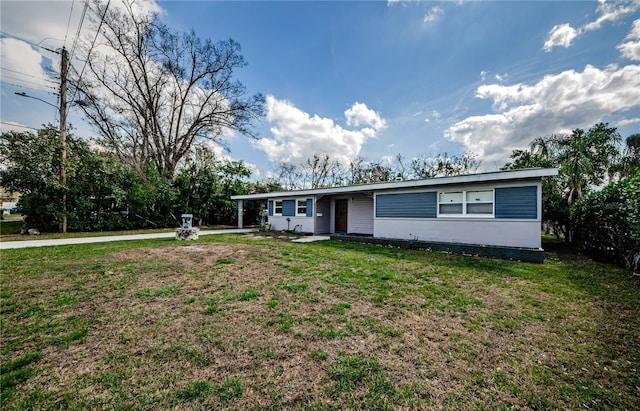 ranch-style home with a front lawn