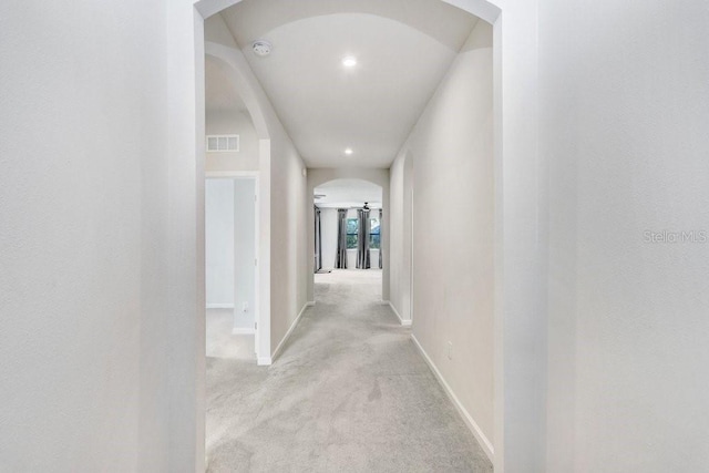 hallway with light carpet