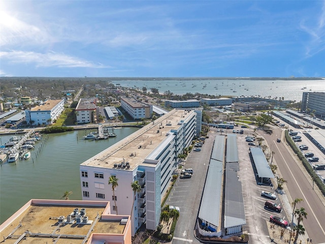 birds eye view of property featuring a water view