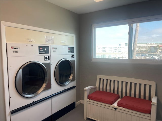 laundry room with washing machine and clothes dryer