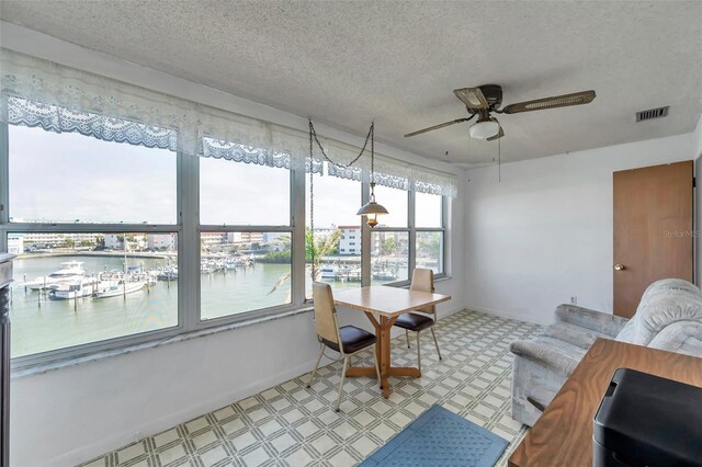 5925 Shore Blvd S Unit 406, Gulfport, FL 33707 - sunroom / solarium featuring visible vents and a water view