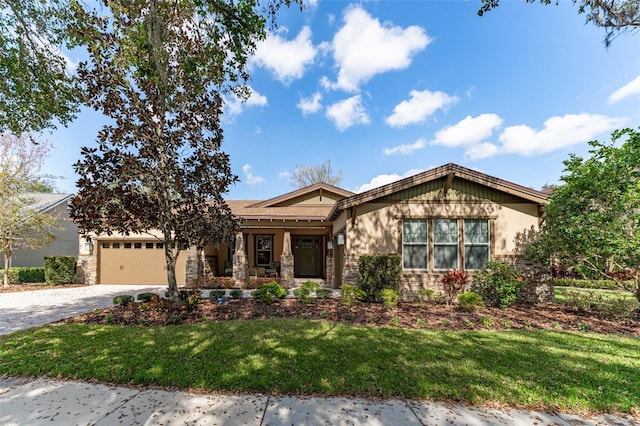 craftsman inspired home with a garage and a front yard