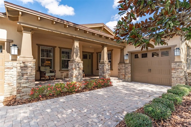 view of front of property with a garage and covered porch