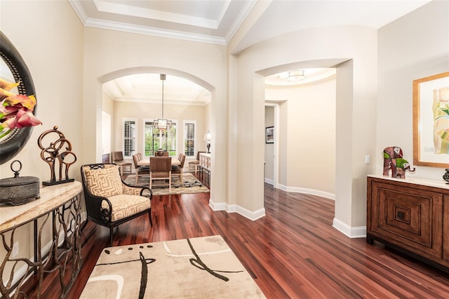 interior space featuring dark hardwood / wood-style flooring and ornamental molding